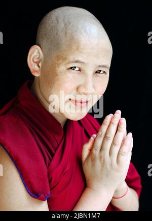Portrait of a Tibetan Buddhist nun. Mcleod Ganj, Dharamsala, India. Stock Photo