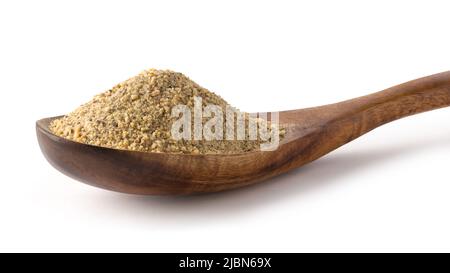 ground horse gram, macrotyloma uniflorum in a wooden spoon, tropical south asian legume most protein rich lentil, isolated on white background Stock Photo