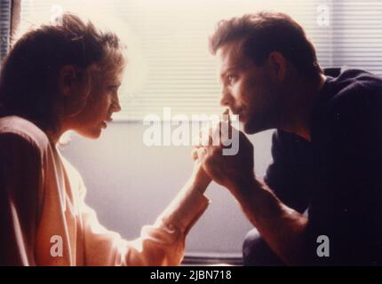 American actors Kim Basinger and Mickey Rourke in the movie 9 1/2 Weeks, USA 1986 Stock Photo