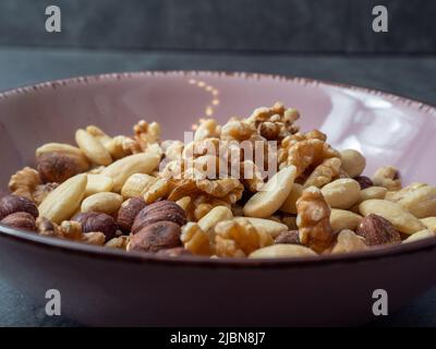 Mix nuts on a wooden background. High quality photo Stock Photo