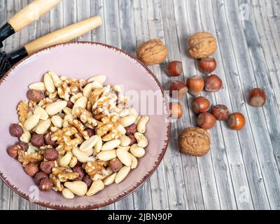 Mix nuts on a wooden background. High quality photo Stock Photo