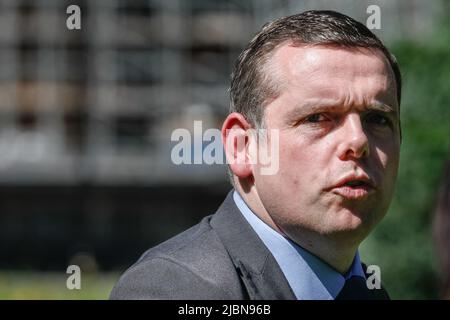 Westminster, London, UK. 07th June, 2022. Douglas Ross, Conservative Party, leader of the Conservative Party of Scotland who has previously called on Boris Johnson to resign. Member of Parliament for Moray. Politicians and commentators are interviewed on College Green in Westminster to give their reactions to yesterday's vote of confidence in the PM and the general political situation. Credit: Imageplotter/Alamy Live News Stock Photo