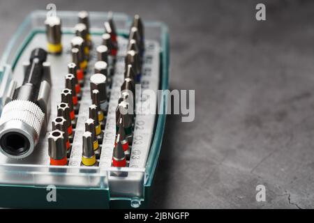 A set of metal bits for screwdrivers in a box. Hexagon head of different sizes Stock Photo