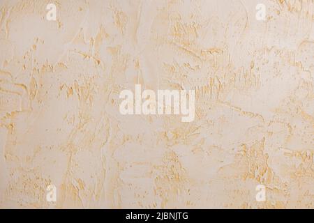 Decorative plaster walls. Beige texture. Home renovation. Stock Photo