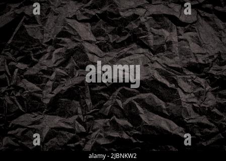 Texture of crumpled black paper. Background from old dark paper Stock Photo