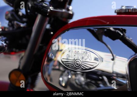Koprivnice, Czech Republic, Czechia - 5 June, 2022: Jawa moto - fuel tank with logo and brand of motorcycle and motorbike manufacturer. Detail of vehi Stock Photo