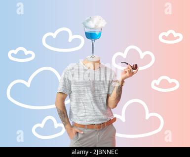 Tattooed man with glass of sweet cotton candy cocktail instead of his head smoking pipe on color background Stock Photo