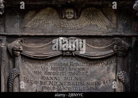 Winged spirit and green man on the 17th century mural monument to John Mylne or Milne (1611-67) in Greyfriars Kirkyard, Edinburgh, Scotland, UK. Stock Photo