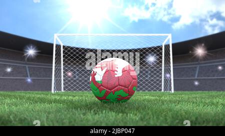 Soccer ball in flag colors on a bright sunny stadium background. Wales. 3D image Stock Photo