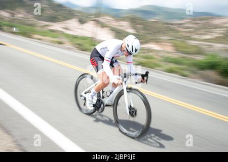 Young amateur cyclists racing in the time trial stage of the 2022 Redlands Classic Stage race. Stock Photo