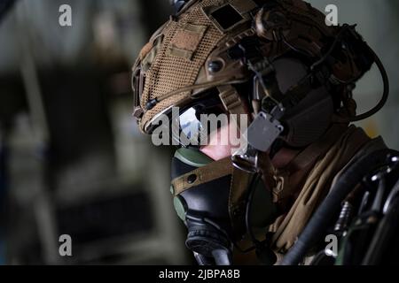 A member of the Armée de l'Air et de l’Espace (French Air and Space Force) prepares to execute a military free fall from a U.S. Air Force MC-130J Commando II assigned to the 352d Special Operations Wing near Cazaux Air Base, France, May 8, 2022. The MFF was part of exercise Athena, a French-led joint and combined Special Operation Forces exercise that validates the full spectrum of integrated component and partner capabilities. Exercises like Athena allow U.S. service members to train at the operational and tactical echelon as a combined, joint force with SOF setting the conditions for larger Stock Photo
