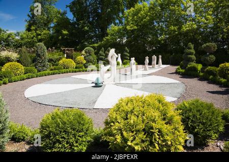 Sculptures in the French formal garden at the Route des Gerbes d'Angelica garden in spring, Mirabel, Quebec, Laurentians, Canada. Stock Photo