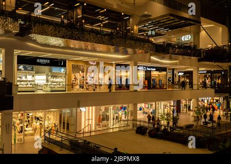 Gdansk Poland - April 2022. Forum gallery shopping mall view of the interior of the building at night. Modern shopping and entertainment centre. Architecture in the city center of Gdansk is the historical capital  Stock Photo