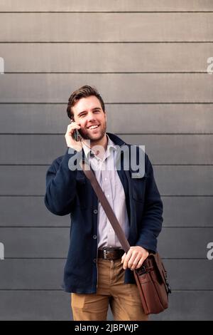 smiling caucasian businessman talking on the phone Stock Photo
