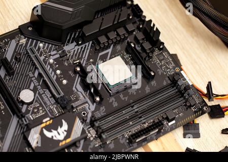 Integrated semiconductor Ryzan microprocessor on circuit board representative of computer technology science. PC microchip. Selected focus. Russia, 17 Stock Photo