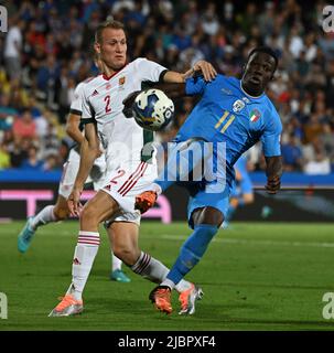 Cesena, Italy. 7th June, 2022. Italy's Degnand Wilfried Gnonto (R) vies with Hungary's Adam Lang during the UEFA Nations League A football match between Italy and Hungary in Cesena, Italy, June 7, 2022. Credit: Alberto Lingria/Xinhua/Alamy Live News Stock Photo