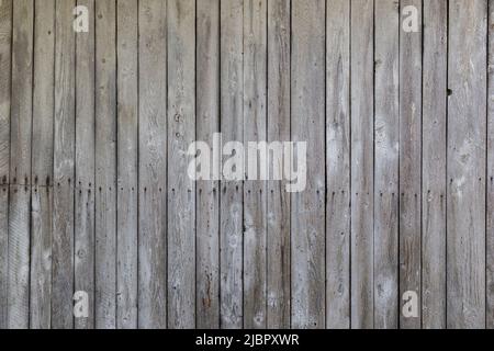 Front view of an old, weathered and aged wooden wall. Abstract full frame textured background. Stock Photo