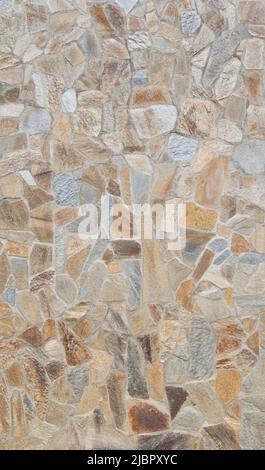 Front view of stone wall made of weathered and multi-colored stone slates. Abstract high resolution full frame textured background. Stock Photo