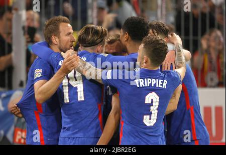 Munich, Germany. 7th June, 2022. England's Harry Kane (1st L) celebrates his goal with teammates during the UEFA Nations League A football match between Germany and England at the Allianz Arena in Munich, Germany on June 7, 2022. Credit: Philippe Ruiz/Xinhua/Alamy Live News Stock Photo