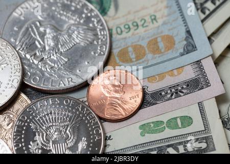 Eisenhower Dollar and Half Dollar on USD Banknotes. United States of America Currency. Federal Reserve Banknotes, 100, fifty and twenty Dollar Bills Stock Photo