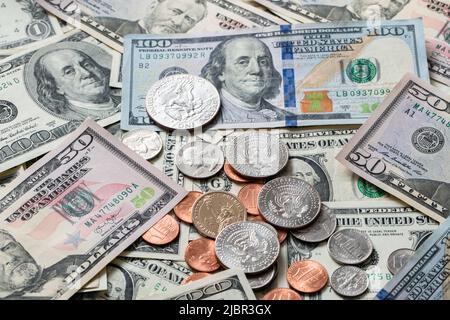 Half Dollar coin on Dollar Banknotes and differed USD coins. American Currency. Federal Reserve Stock Photo