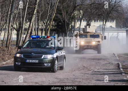 Lublin, Poland - March 25, 2015: United States Army vehicle (Armored Personnel Carrier) Humvee passing city streets Stock Photo