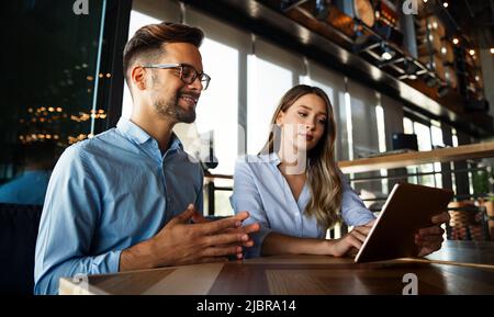 Business colleagues having conversation during coffee break Stock Photo