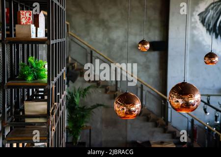 Interior decoration of stylish housing. Loft style incandescent lamp. Modern style home design. Stock Photo