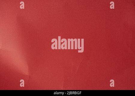 an empty wrinkled red pearl tissue paper textured background. text space for quotations Stock Photo