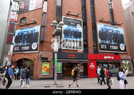 A billboard of South Korean boy band BTS is seen at Shibuya shopping district in Tokyo, Japan on June 8, 2022. Credit: AFLO/Alamy Live News Stock Photo