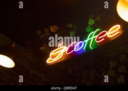 Colorful Coffee Logo, illuminated with neon lights Stock Photo