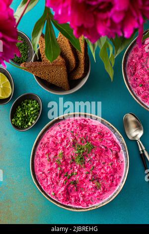 Cold soup svekolnik, Borscht or Chlodnik , soup made from boiled beets, potatoes and fresh vegetables Stock Photo