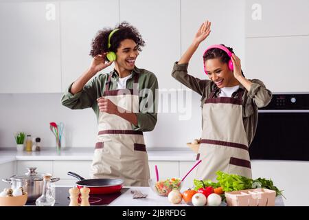 Premium Photo  Cooking utensils. cooking woman in kitchen with frying pan  and wooden spoon. housewife dancing.