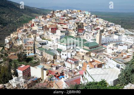 View of the green tiled roofs of the holy city of Moulay Idris, Morocco including the tomb and Zawiya of Moulay Idriss, Middle Atlas, North Africa.