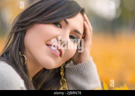 Natural close-up outdoor portrait of ordinary mixed race woman Stock Photo