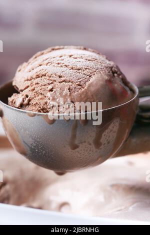 hand picking ice cream with a spoon from a bowl  Stock Photo