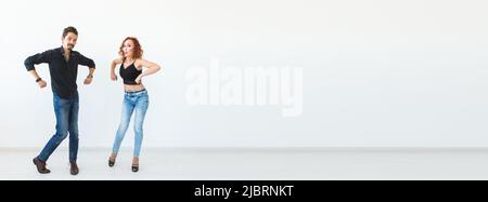 Banner social dance concept - Crazy dancing, cheerful couple over white background copy space and place for advertising Stock Photo