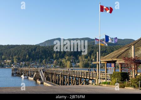 Rocky Point Park during sunset time. Long pier over the ocean. Port Moody, British Columbia, Canada. Stock Photo