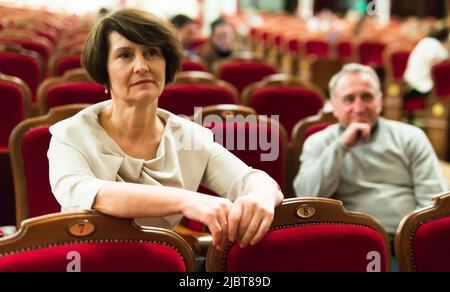 elderly couple watching play in the theater Stock Photo