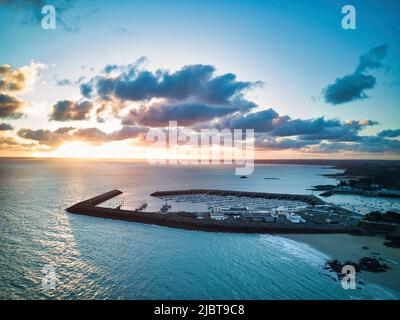 France, Côtes d'Armor, Bay of Saint Brieuc, Saint Quay Portrieux, sunrise over the water port (aerial view) Stock Photo