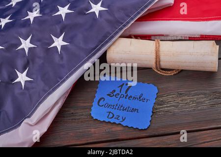 September seventeenth constitution day concept. Top view flat lay. Old scroll with United States constitution preamble with handwritten we the people. Stock Photo