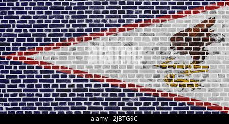 Close-up on a brick wall with the flag of the American Samoa painted on it. Stock Photo