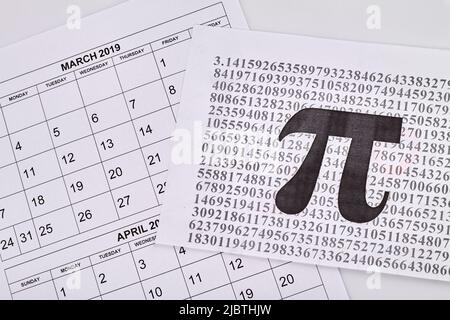 Pi number day in 14 march. Paper with full pi number. White paper calendars. Stock Photo