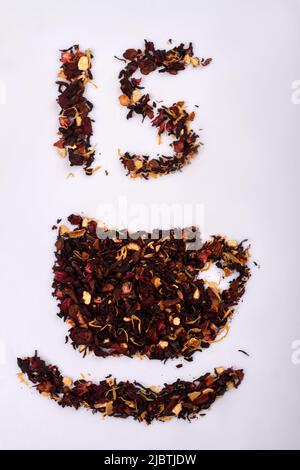 Tea day concept. 15 number and cup shapes on white background. Top view flat lay. Stock Photo