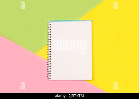 Open notebook on a multicolor background with copy space Stock Photo