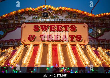 Sign for sweet & treat shop at the Christmas market of Hyde Park Winter Wonderland in London Stock Photo