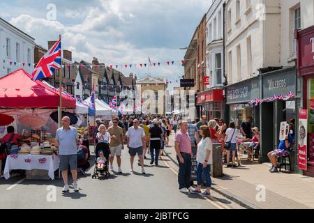 Crowds of people enjoy browsing a street market in Stratford on Avon during the Queens Platinum Jubilee celebrations. Stock Photo