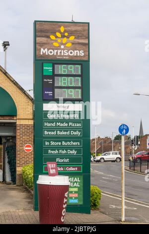 May 2022 fuel prices outside a garage attached to a Morrisons supermarket at King's Lynn in Norfolk. Stock Photo