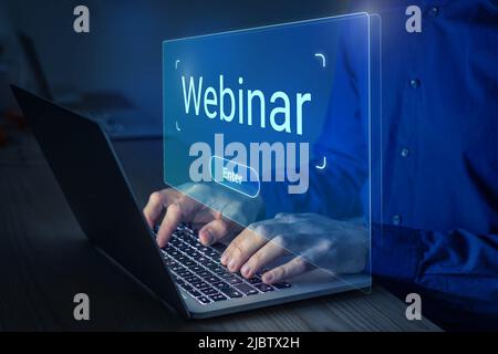 Webinar online education, conference, course, meeting on internet. Person clicking button join, enter or watch live stream on laptop computer. Communi Stock Photo