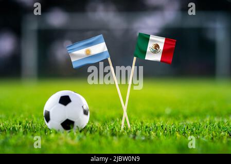 Argentina vs. Mexico, Lusail, Football match wallpaper, Handmade national  flags and soccer ball on green grass. Football stadium in background. Black  Stock Photo - Alamy
